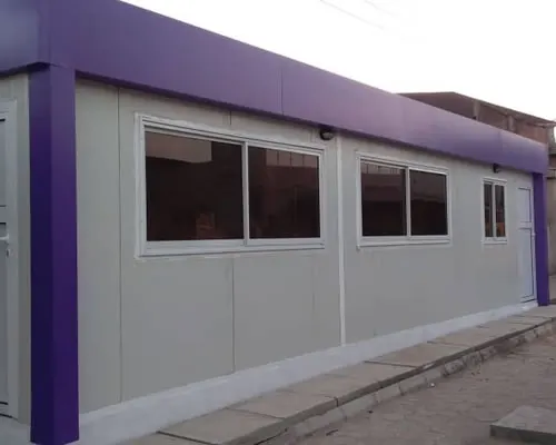 Portacabin with purple trim and sliding windows