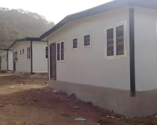 Row of white portacabins with grey roofs
